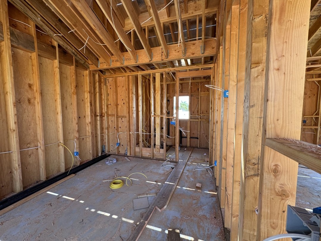 Interior wall framing with electrical wiring and boxes installed before drywall in the Solana Beach ADU