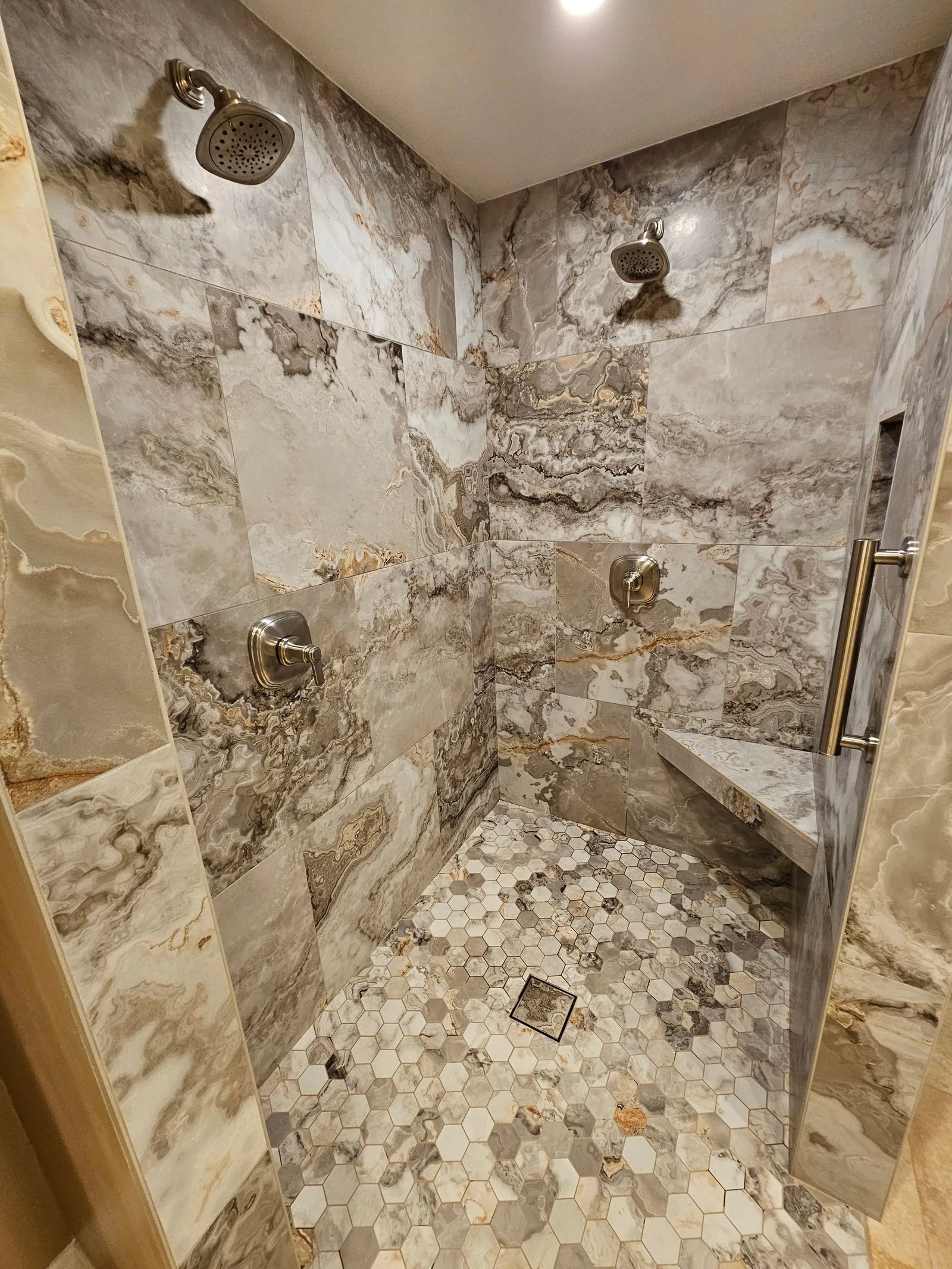 Finished bathroom remodel with marble hexagon tile shower by Cali Dream Construction