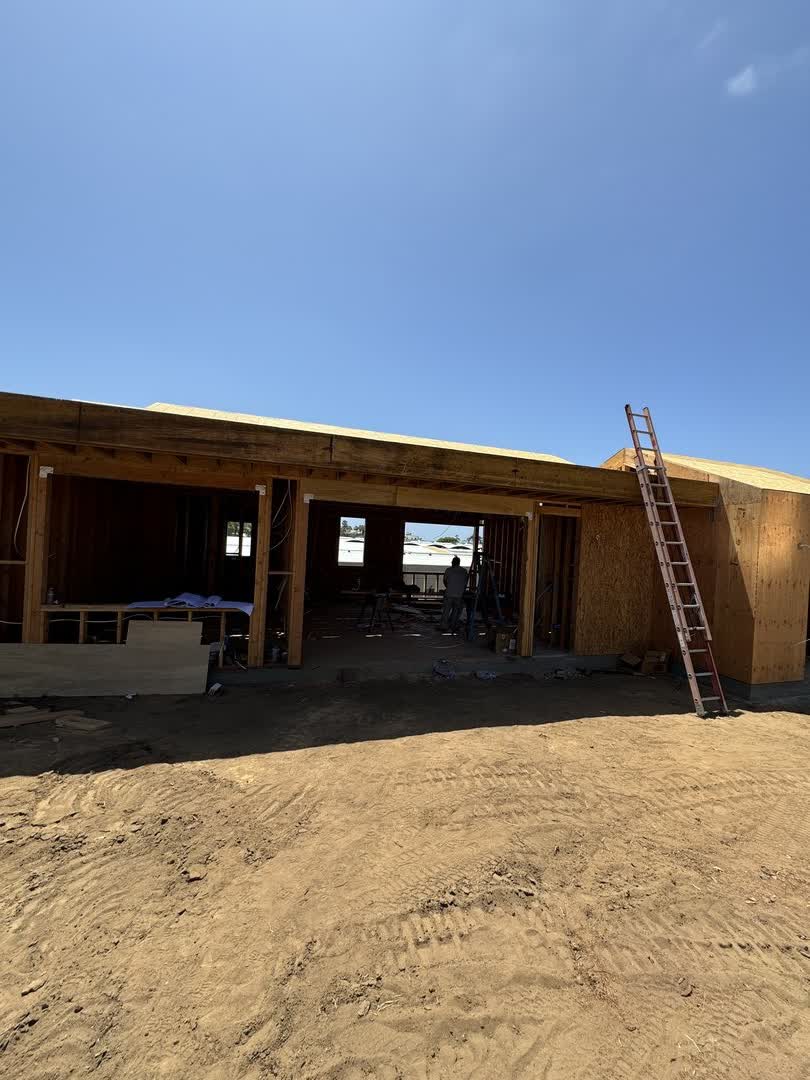 Wood framing going up on the Solana Beach new build, walls open before sheathing