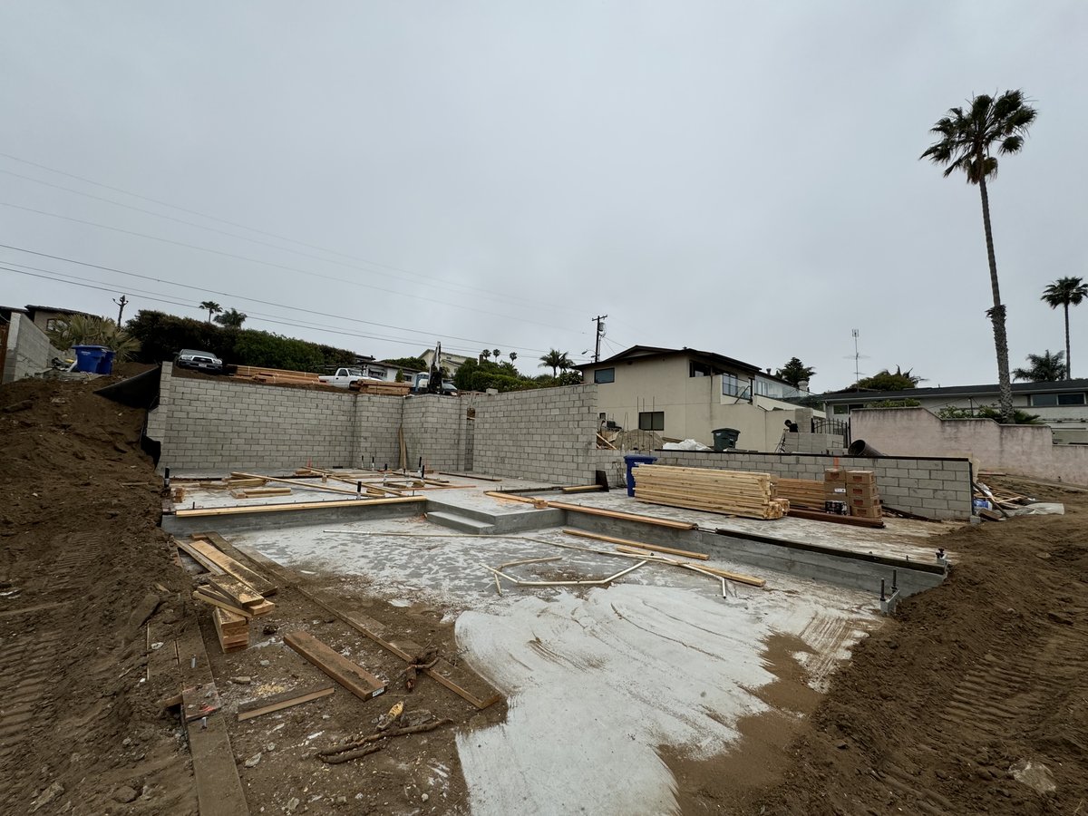 Foundation and block walls with palm trees