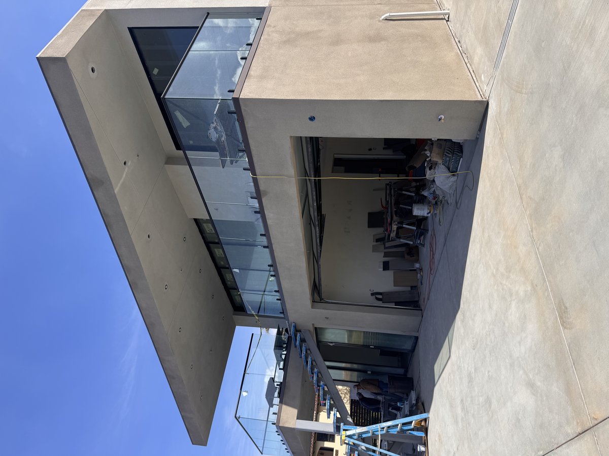 Modern home exterior with brown metal roof